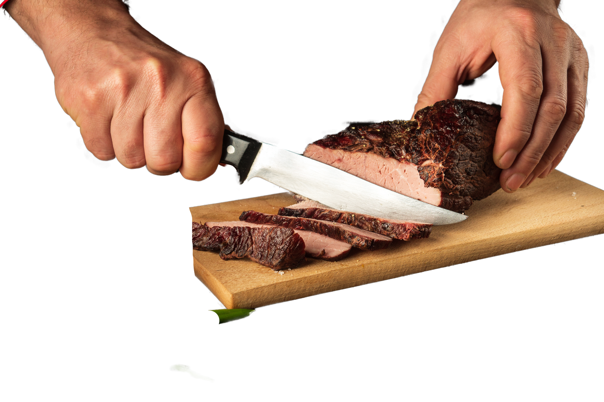 The cook cuts the baked veal meat on a cutting board. The concep